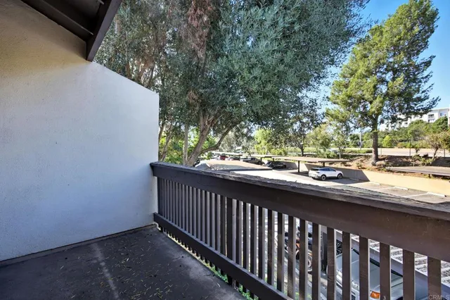 a view of balcony with wooden floor