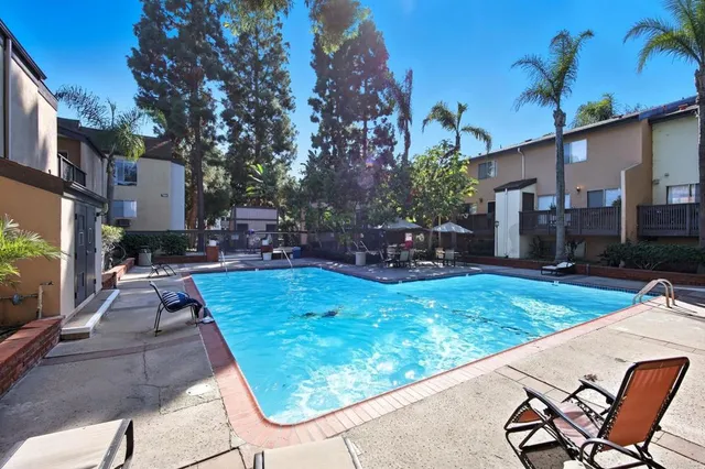 a view of a backyard with sitting area