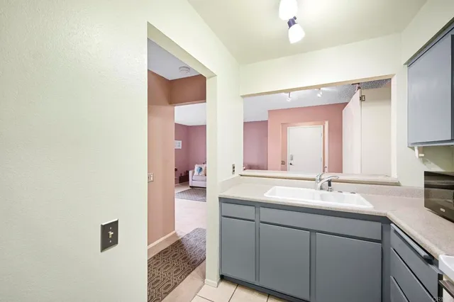 a bathroom with a double vanity sink mirror and