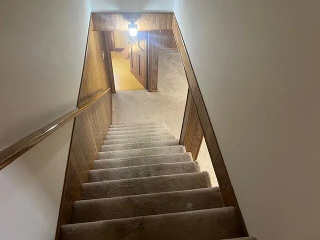 a kitchen with a table and chairs