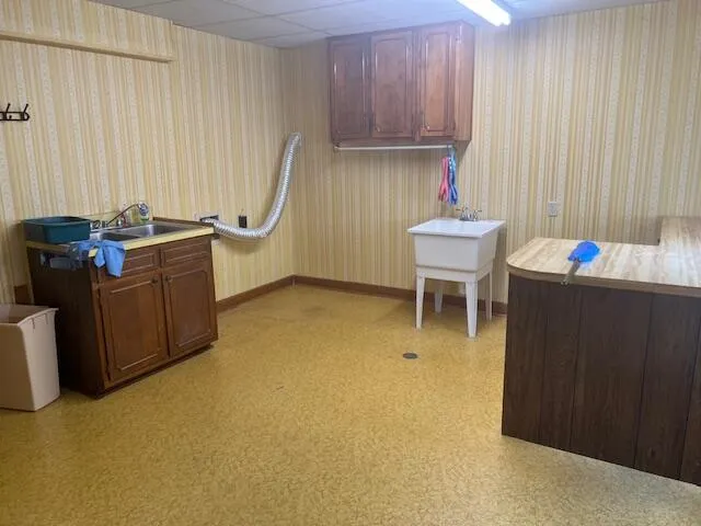 a view of backyard of house with green space