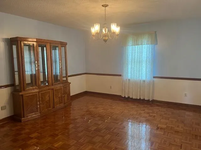 a view of empty room with a fireplace
