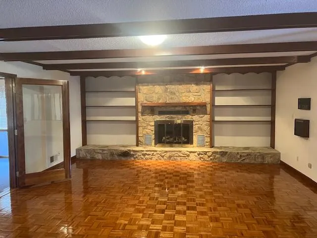 a kitchen with a refrigerator a sink and cabinets