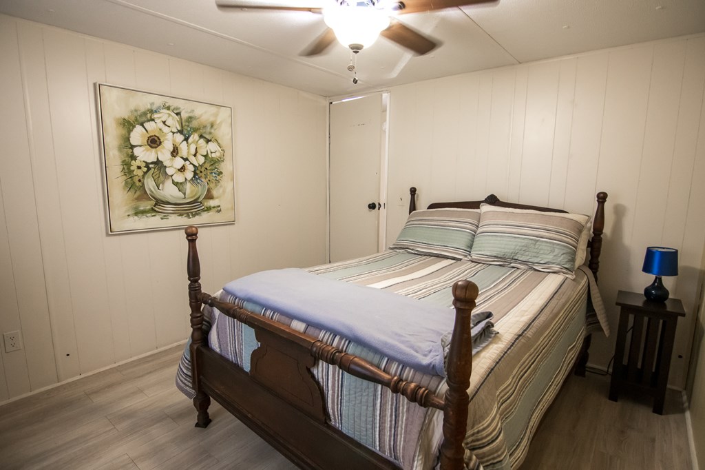 1631 West Pine Lake Drive West Point, GA 31833 - Photo 21 of 37 a bed sitting in a bedroom next to a window