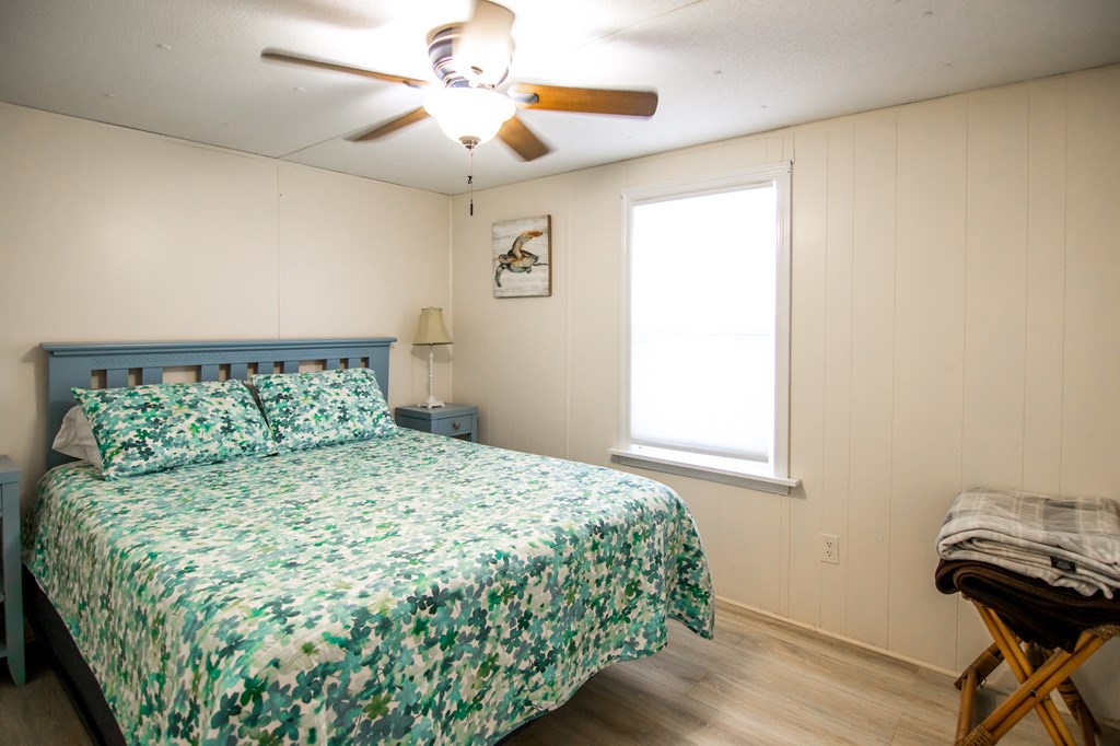 1631 West Pine Lake Drive West Point, GA 31833 - Photo 24 of 37 a bedroom with a bed and a window