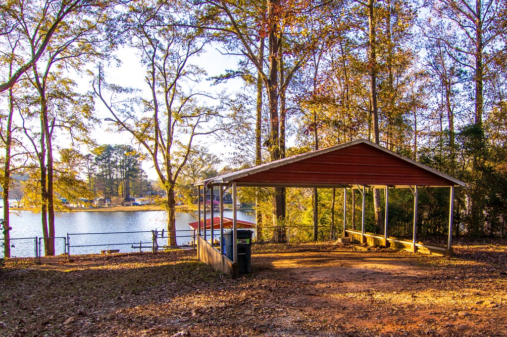 1631 West Pine Lake Drive West Point, GA 31833 - Photo 33 of 37 a view of a house with a yard and sitting area