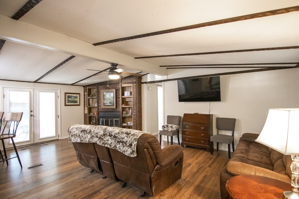 1631 West Pine Lake Drive West Point, GA 31833 - Photo 9 of 37 a living room with furniture and a flat screen tv