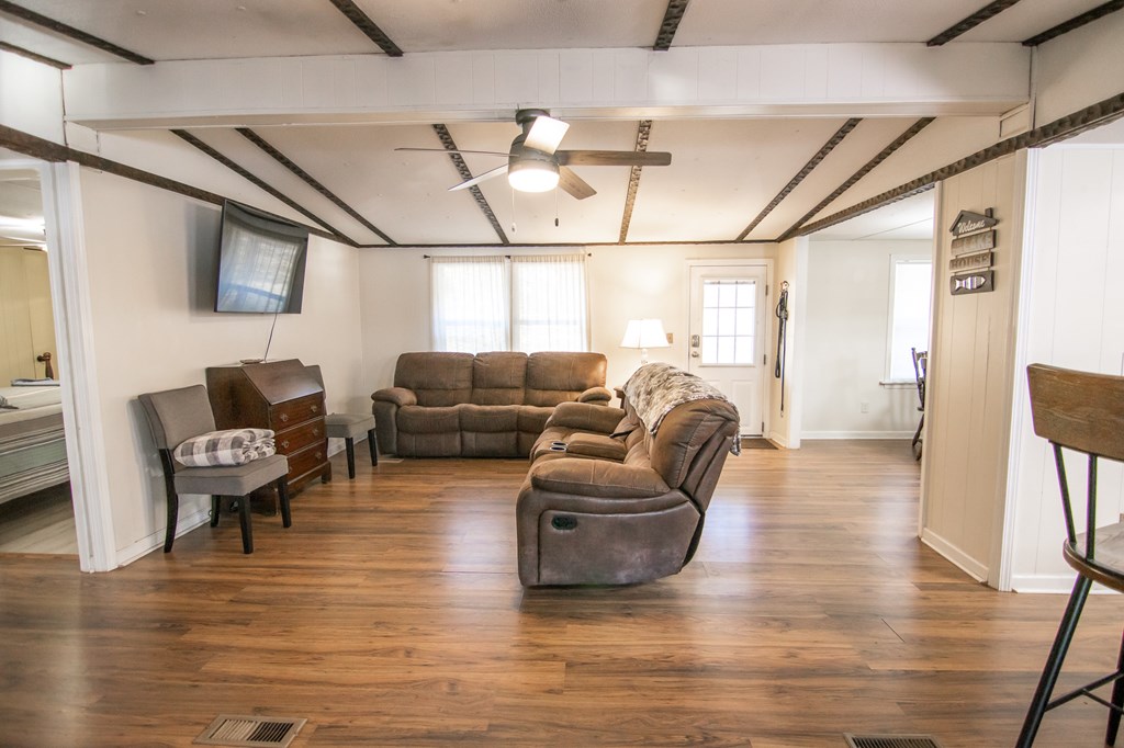 1631 West Pine Lake Drive West Point, GA 31833 - Photo 10 of 37 a living room with furniture and a large window
