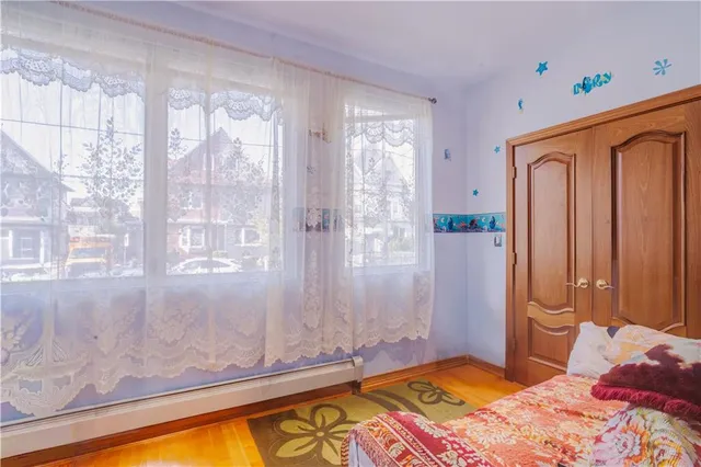 a bedroom with a bed and a table in it