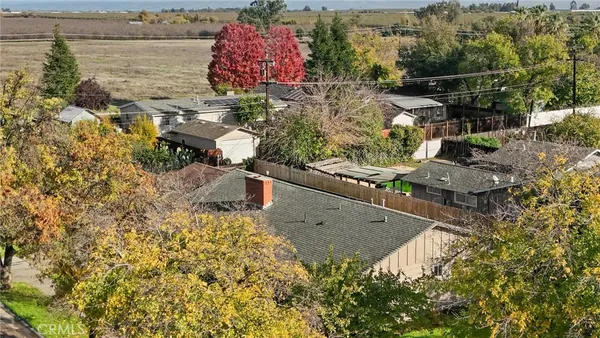 an aerial view of a house with a yard