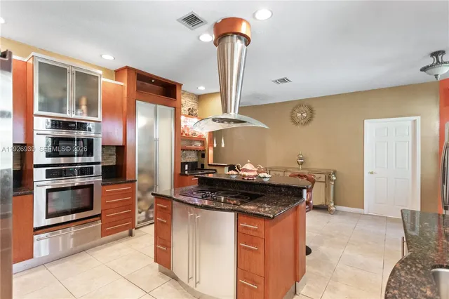 a view of a living room hardwood floor and a large window