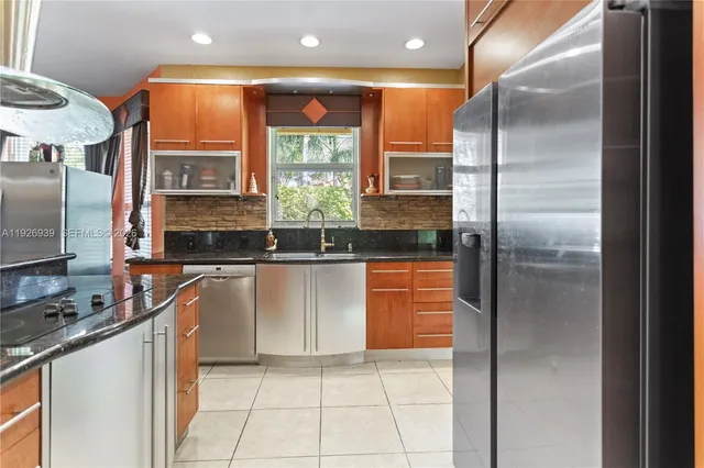 a view of a hallway with a livingroom and a bathroom