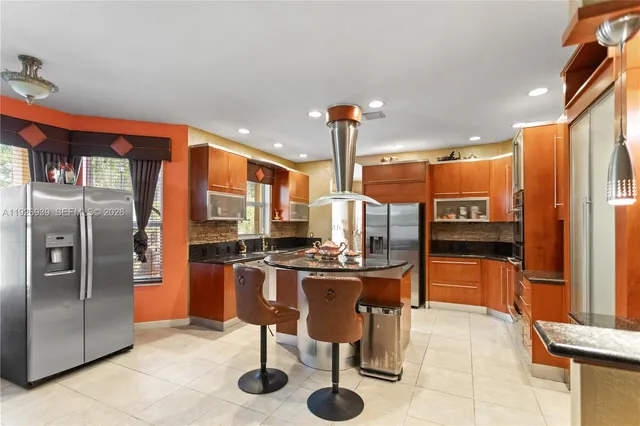 a bedroom with bed and a chandelier