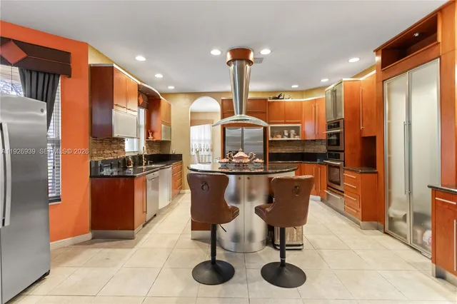 a large room with a large window and furniture