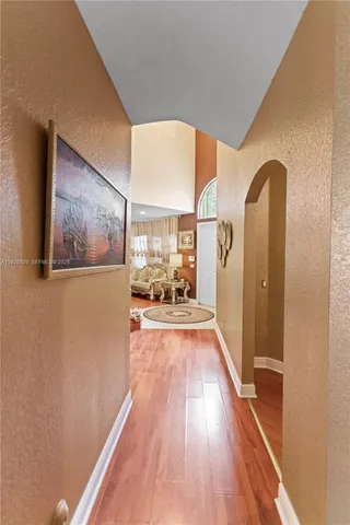 a bathroom with a tub a sink and a mirror