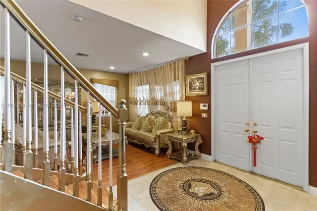 a bathroom with a tub a sink and a mirror
