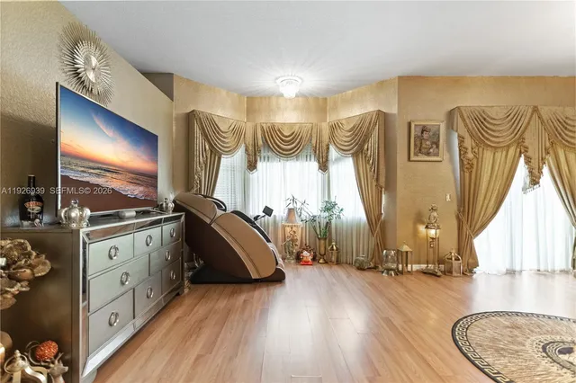 a bathroom with a double vanity sink mirror and shower