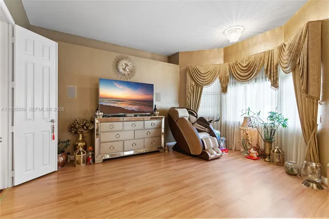 a view of a porch with furniture and garden