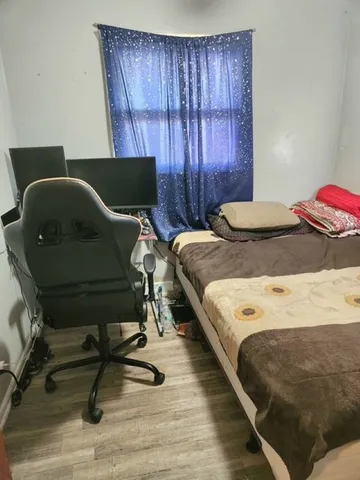 a bedroom with a bed and furniture