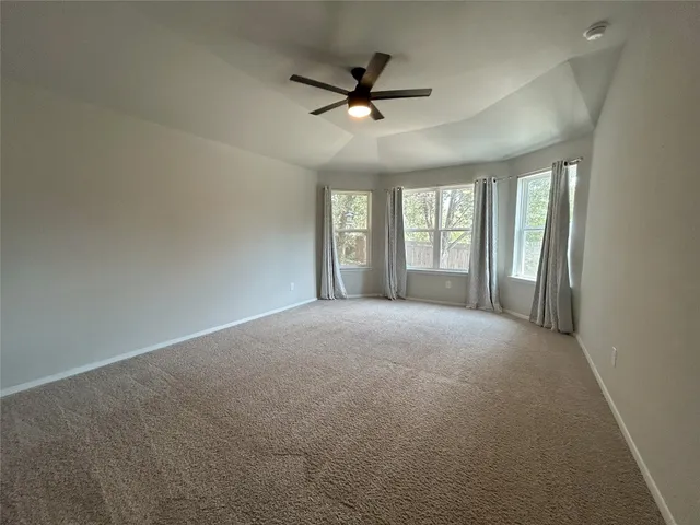 a large kitchen with stainless steel appliances kitchen island granite countertop a large counter top and wooden floors