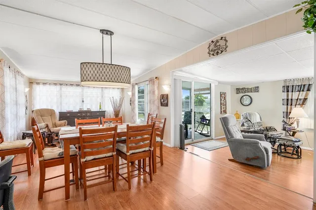 a view of a livingroom with furniture window and wooden floor