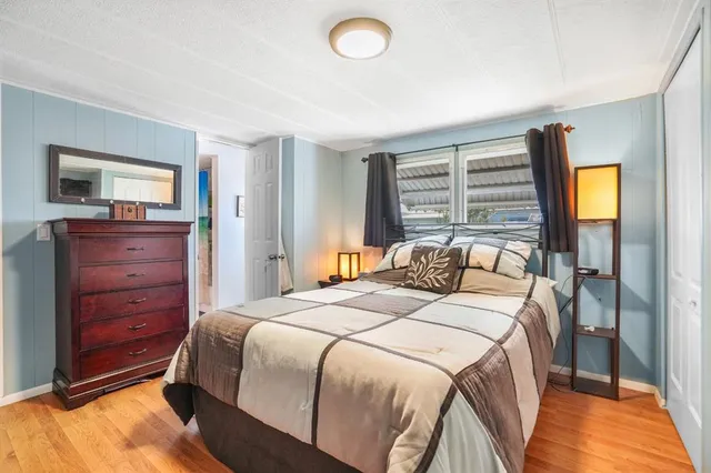 a bedroom with a bed and a dresser