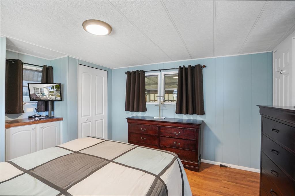 2001 Southwest 84th Avenue Davie, FL 33324 - Photo 25 of 38 a bedroom with a bed and a dresser