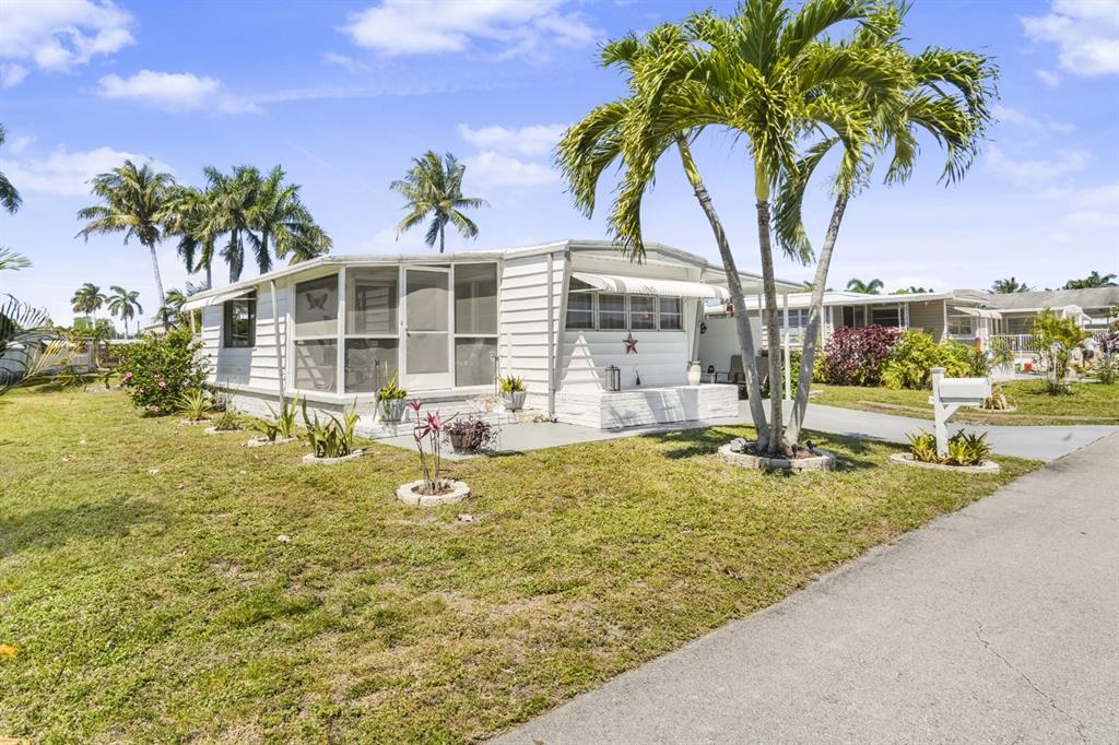 2001 Southwest 84th Avenue Davie, FL 33324 - Photo 33 of 38 a backyard of a house with table and chairs
