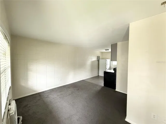 a view of a kitchen with a sink and a window