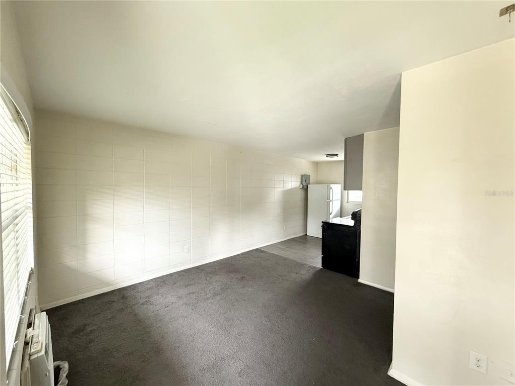 639 Ramona Lane, Unit 6 Orlando, FL 32805 - Photo 2 of 18 a view of a kitchen with a sink and a window