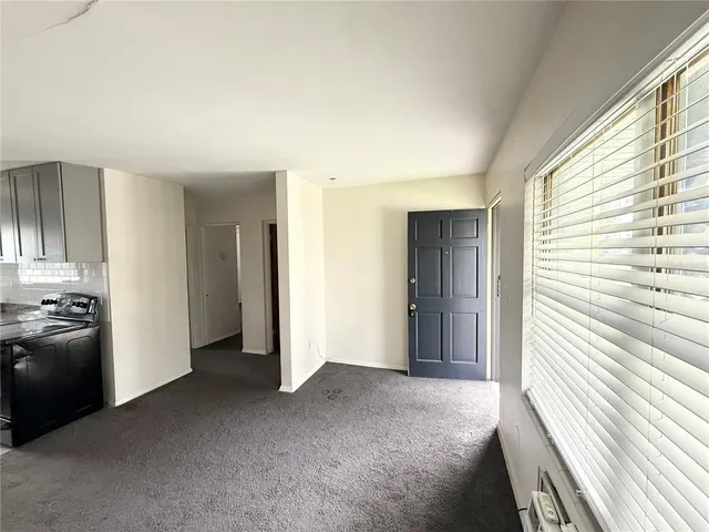 a view of a livingroom with a kitchen