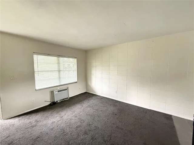 an empty room with a windows