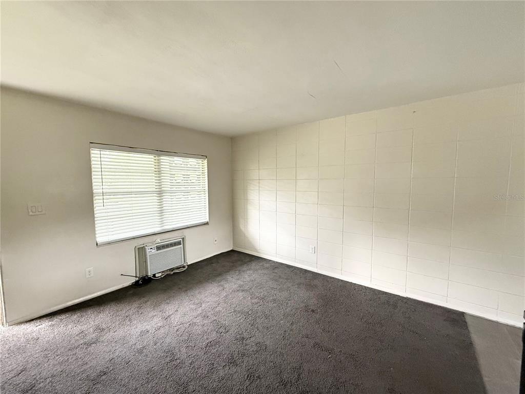 639 Ramona Lane, Unit 6 Orlando, FL 32805 - Photo 4 of 18 an empty room with a windows