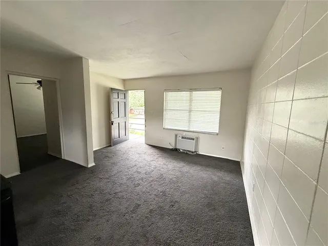 a kitchen with a stove top oven and cabinets
