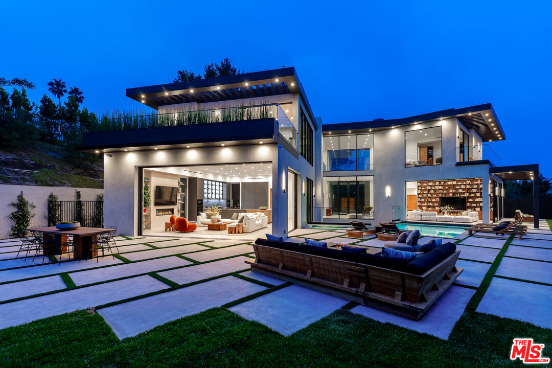 1523 Stradella Road Los Angeles, CA 90077 - Photo 11 of 54 a outdoor living space with furniture and a fireplace