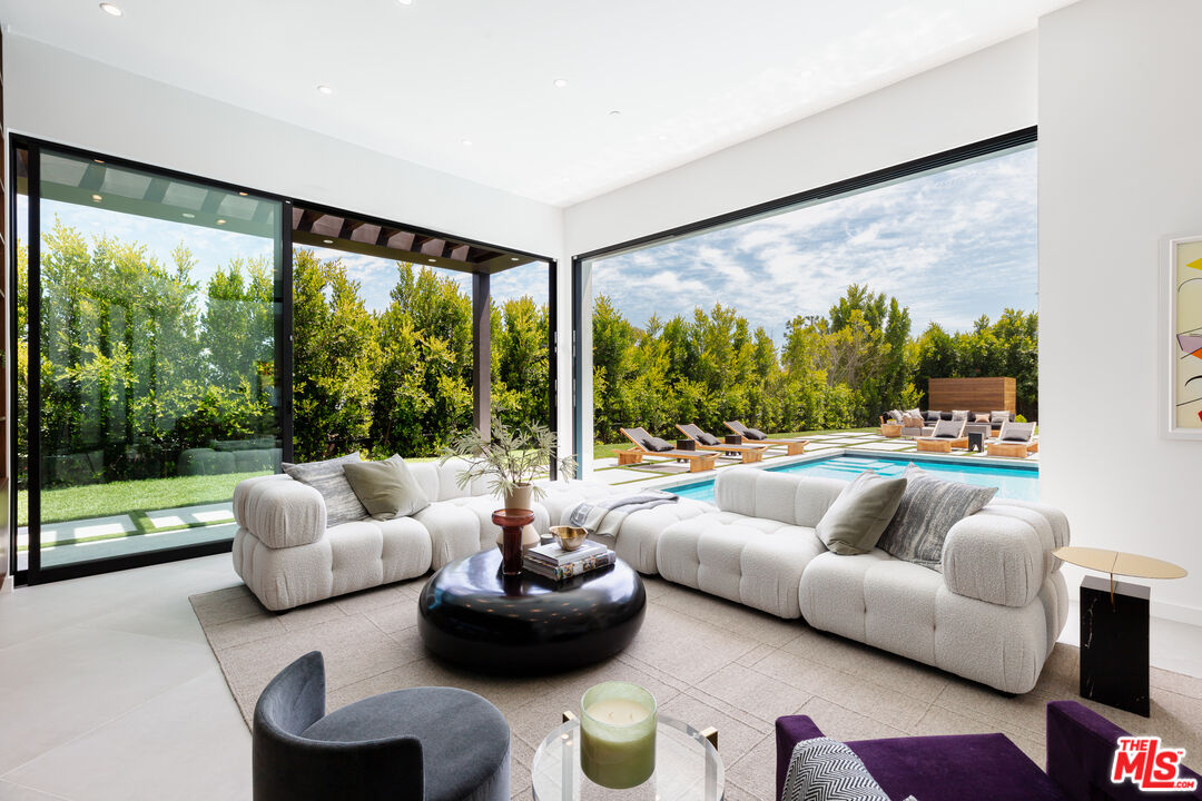 1523 Stradella Road Los Angeles, CA 90077 - Photo 18 of 54 a living room with furniture and a large window