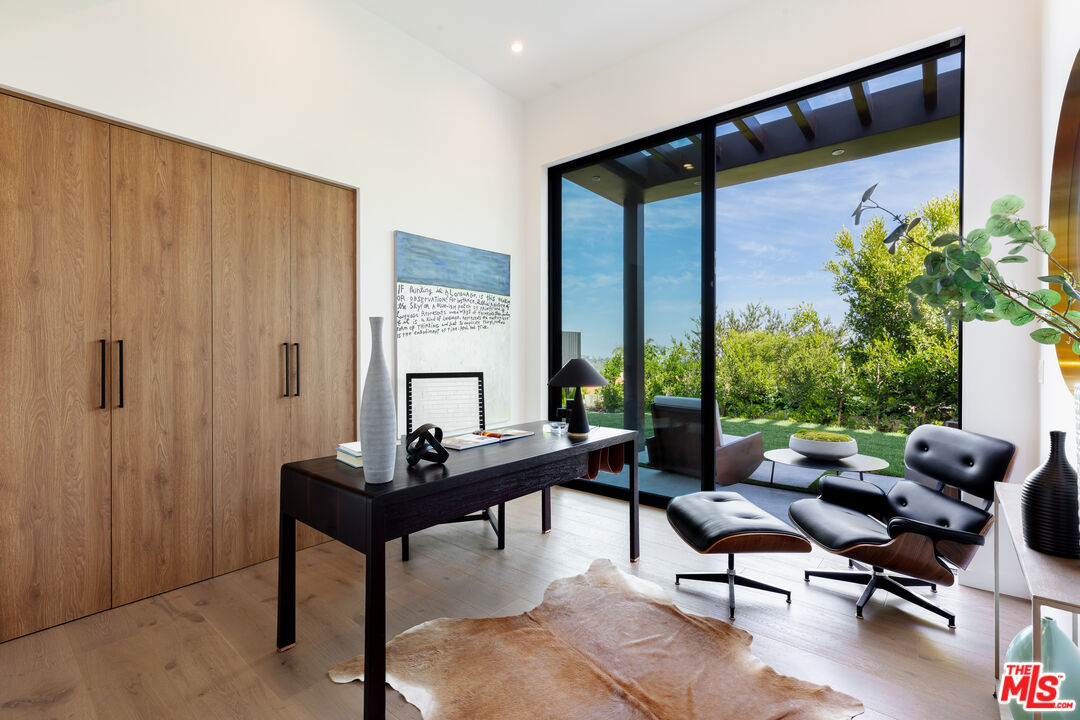 1523 Stradella Road Los Angeles, CA 90077 - Photo 21 of 54 a living room with furniture and a window