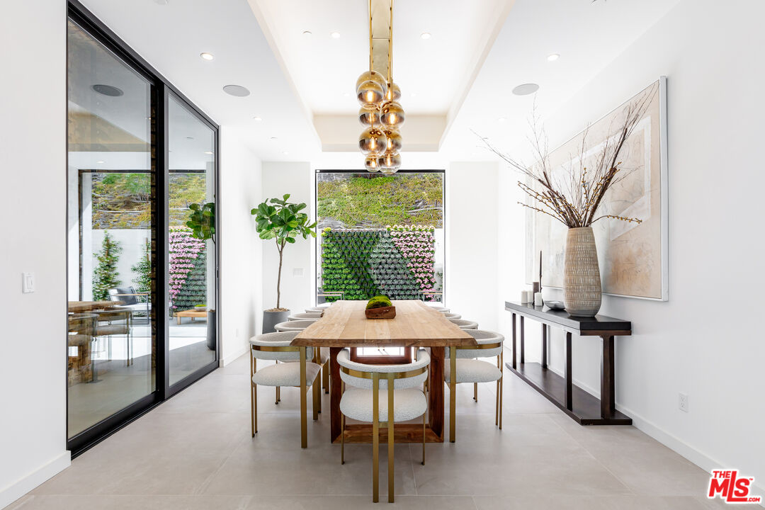 1523 Stradella Road Los Angeles, CA 90077 - Photo 23 of 54 a dining room with furniture and window