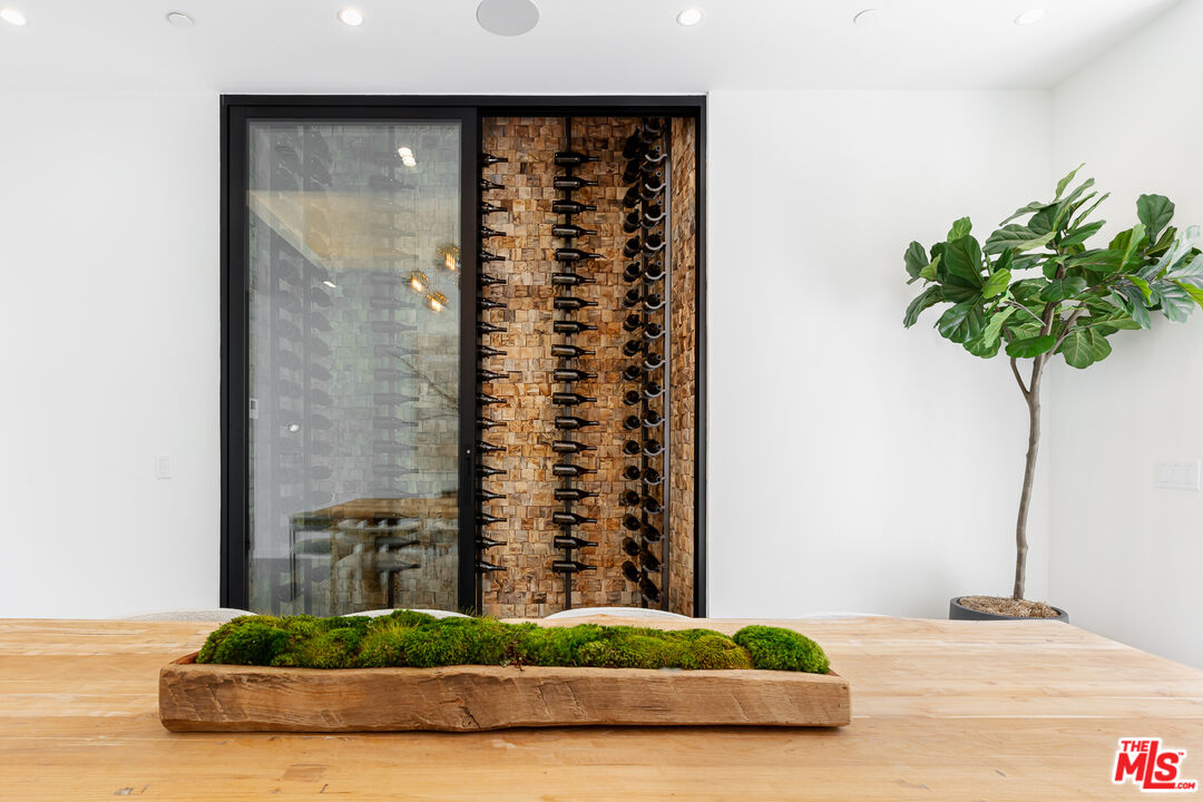 1523 Stradella Road Los Angeles, CA 90077 - Photo 24 of 54 a vase of flowers sitting on a table