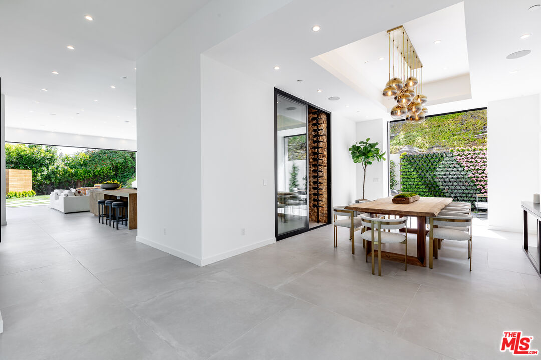 1523 Stradella Road Los Angeles, CA 90077 - Photo 27 of 54 a view of a livingroom with furniture and a window