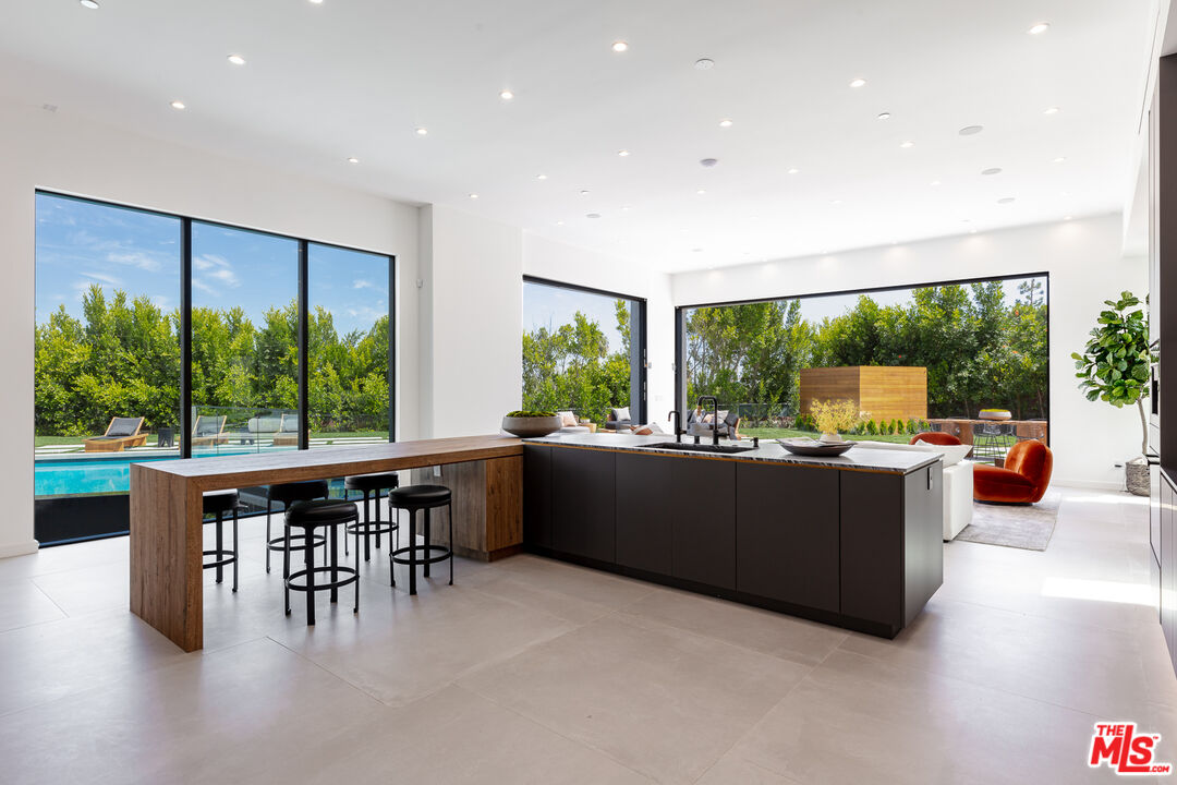 1523 Stradella Road Los Angeles, CA 90077 - Photo 32 of 54 a living room with furniture and a large window
