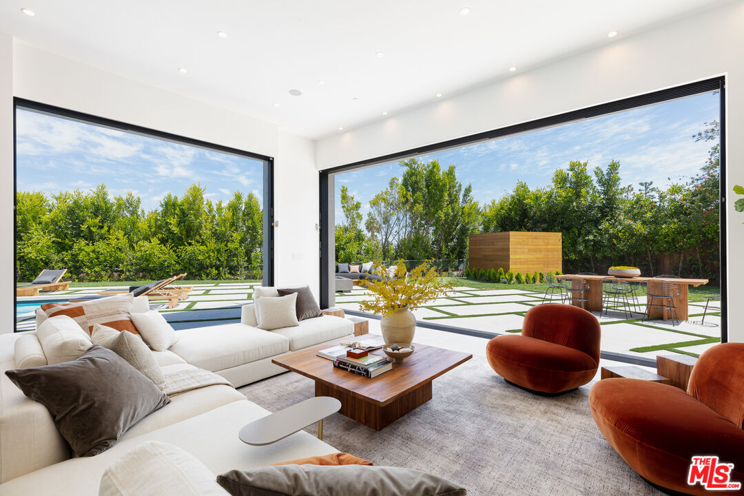 1523 Stradella Road Los Angeles, CA 90077 - Photo 34 of 54 a living room with furniture and a large window