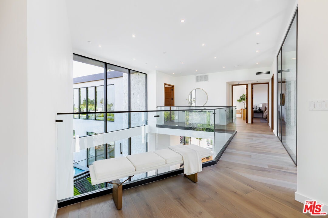 1523 Stradella Road Los Angeles, CA 90077 - Photo 37 of 54 a living room with a couch and a wooden floor