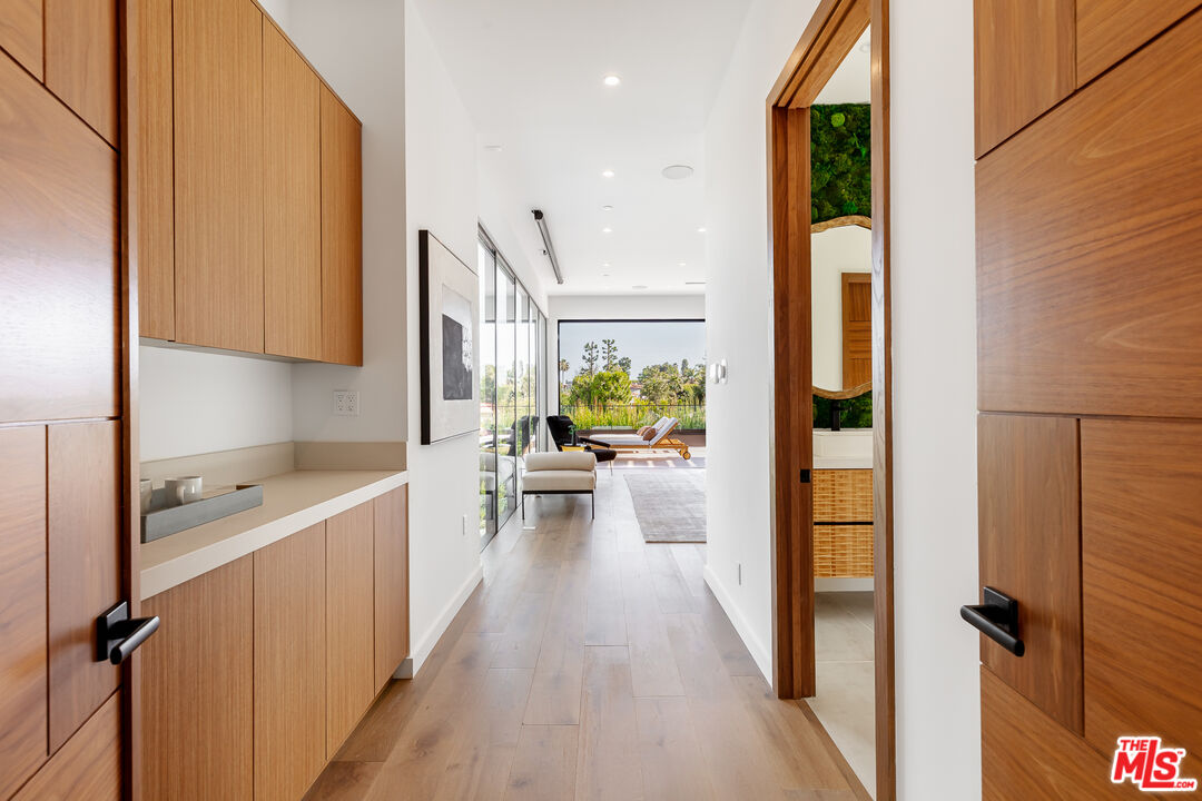 1523 Stradella Road Los Angeles, CA 90077 - Photo 38 of 54 a view of a kitchen with a sink and refrigerator