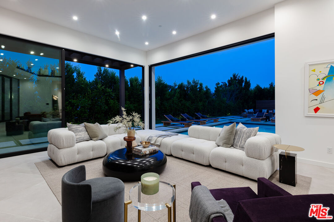 1523 Stradella Road Los Angeles, CA 90077 - Photo 4 of 54 a living room with furniture and a large window