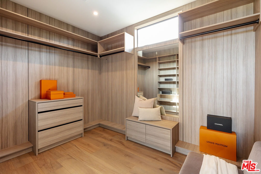 1523 Stradella Road Los Angeles, CA 90077 - Photo 42 of 54 a room that has a bed and a chair in it