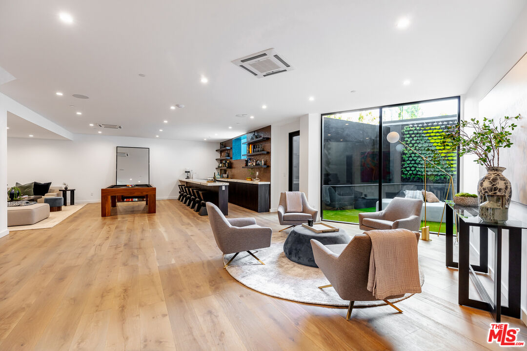 1523 Stradella Road Los Angeles, CA 90077 - Photo 49 of 54 a living room with furniture and a large window