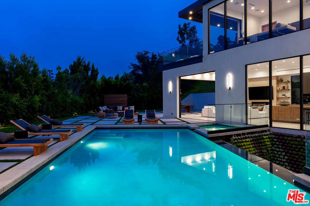 1523 Stradella Road Los Angeles, CA 90077 - Photo 5 of 54 a view of a swimming pool with outdoor seating