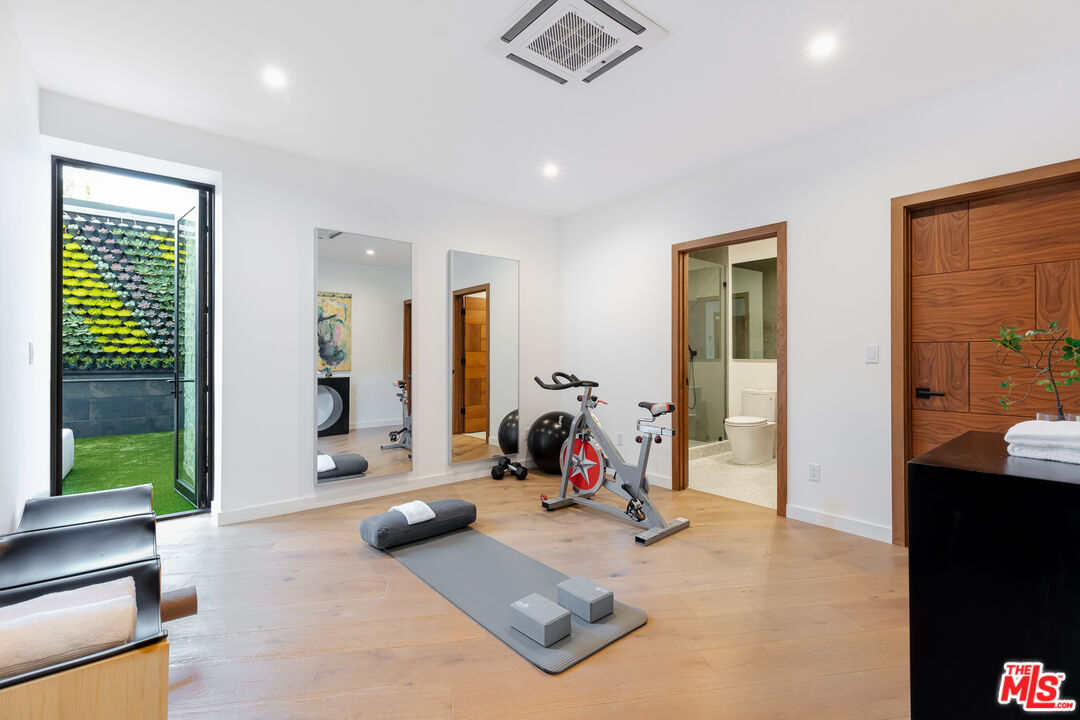 1523 Stradella Road Los Angeles, CA 90077 - Photo 51 of 54 a view of a room with gym equipment