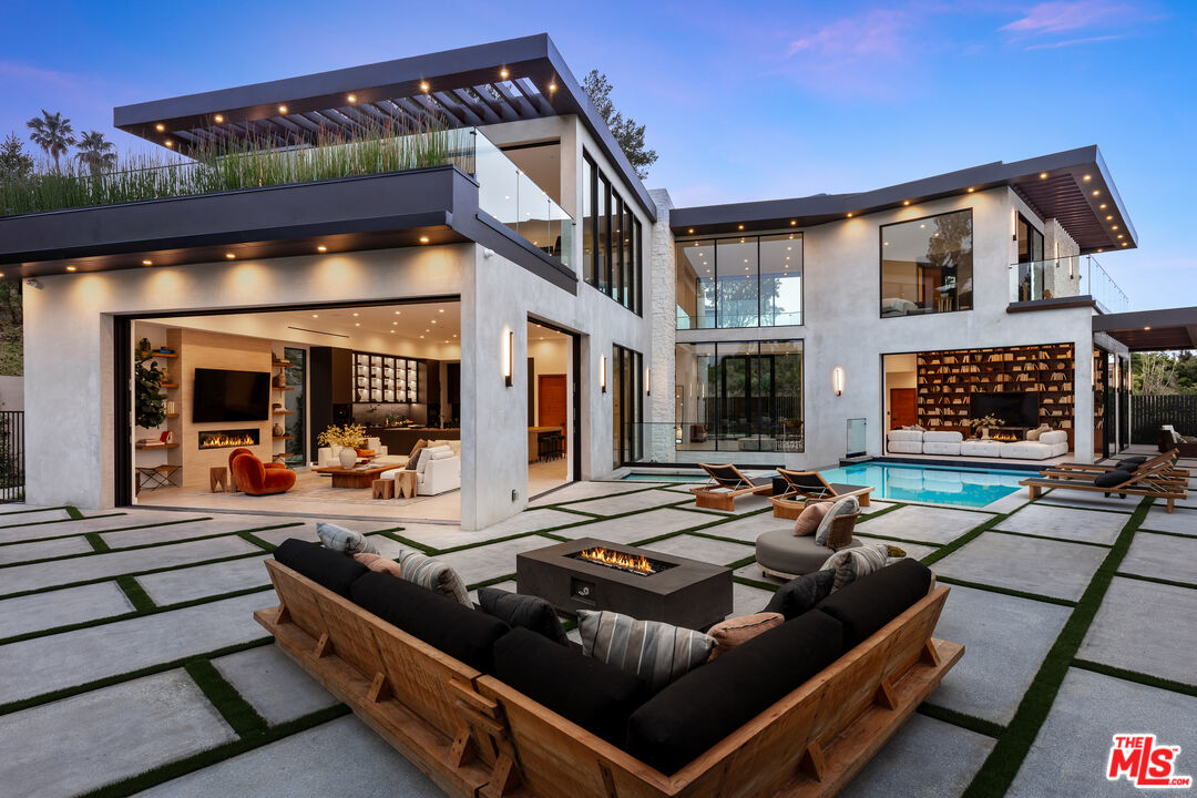 1523 Stradella Road Los Angeles, CA 90077 - Photo 53 of 54 a outdoor living area with furniture and a fireplace